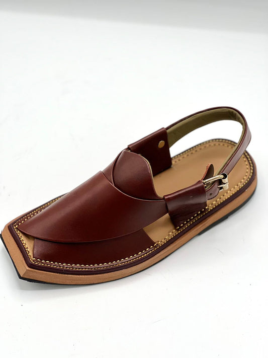 Brown sandal with a strap on a white background