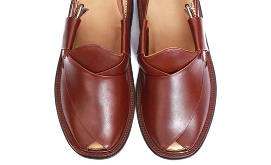 Pair of brown leather shoes on a white background