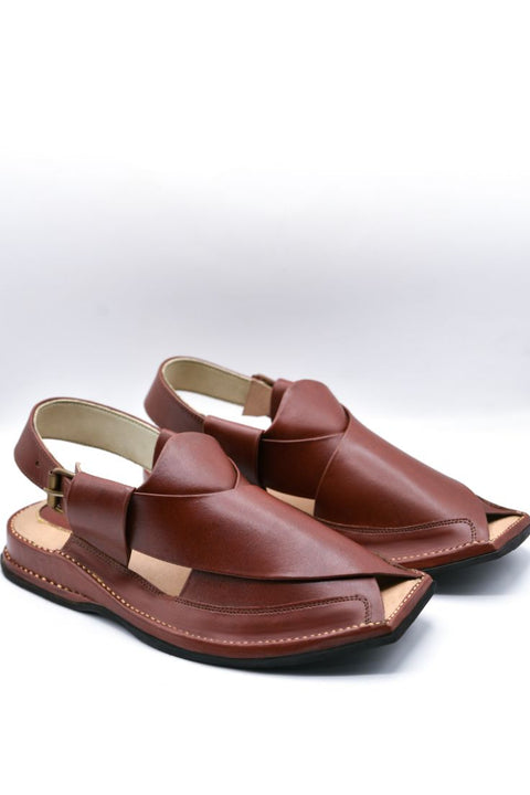 Pair of brown sandals on a white background