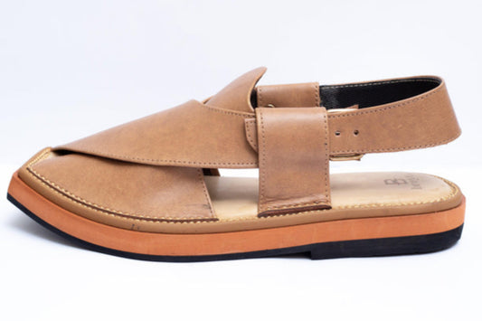 Tan sandal with a strap on a white background